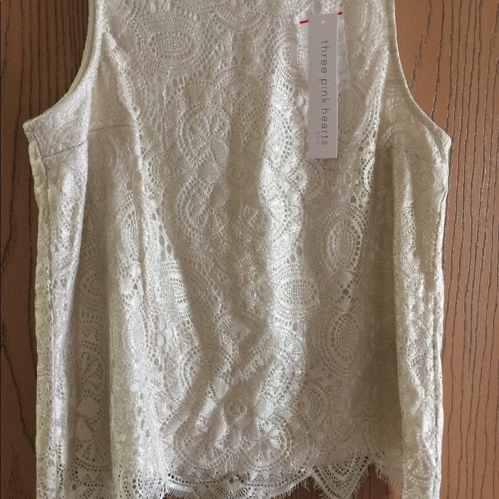 Sleeveless glitter top size L but it looks M